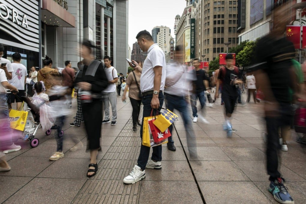 Pedestrians and shoppers on Nanjing Road in Shanghai on October 3, 2023. Photo: Bloomberg