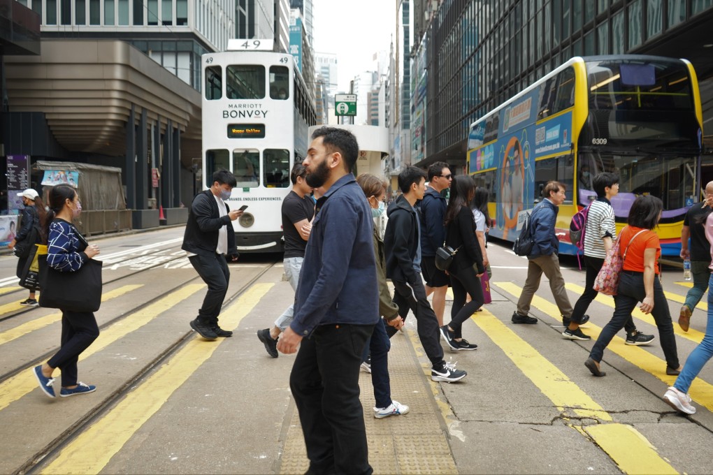 People cross a road in Central, Hong Kong. Is casual racism accepted as a small price to pay for a life in a city envied by much of Asia for its high standard of living? Photo: Shutterstock