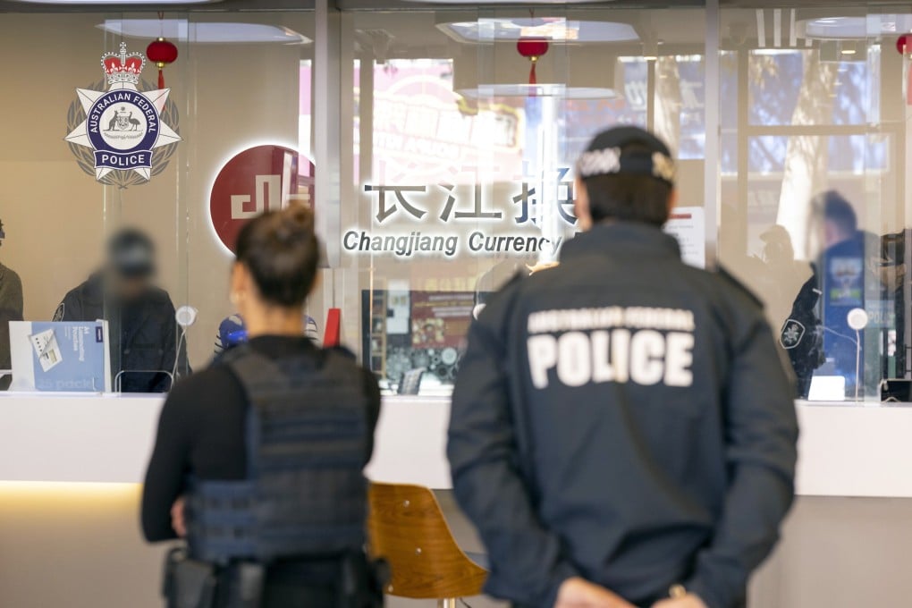 Police raid a Changjiang Currency Exchange outlet in Sydney. Photo: Australian Federal Police