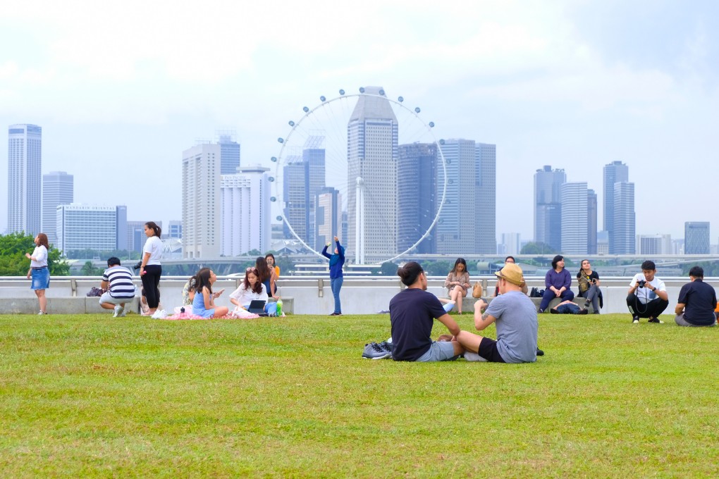 People in Singapore enjoy a day out at Marina Barrage. Photo: Shutterstock