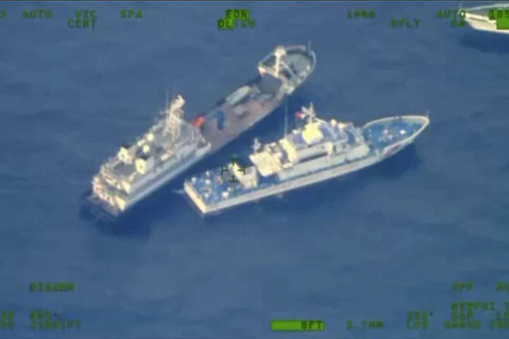A Chinese militia vessel, top, and a Philippine coast guard ship near the Second Thomas Shoal in the disputed South China Sea on October 22. Photo: Armed Forces of the Philippines via AP