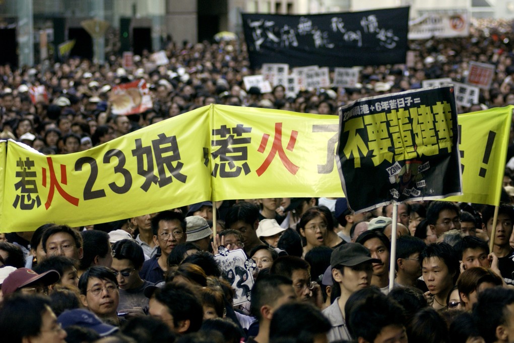 A flashback to protests in 2003 in Causeway Bay as marchers travel from Victoria Park in to to the Government headquarters in Central. Photo: Jonathan Wong
