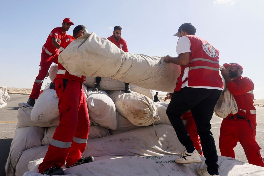 Egyptian Red Crescent members coordinate aid for Gaza at Al-Arish Airport in Egypt on October 20. Photo: Reuters