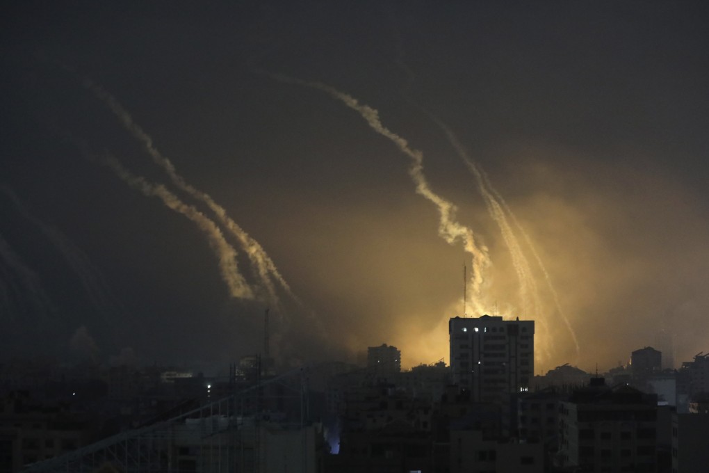 Smoke and explosions caused by Israeli bombardment are seen on the horizon in northern Gaza on Saturday. Photo: AP