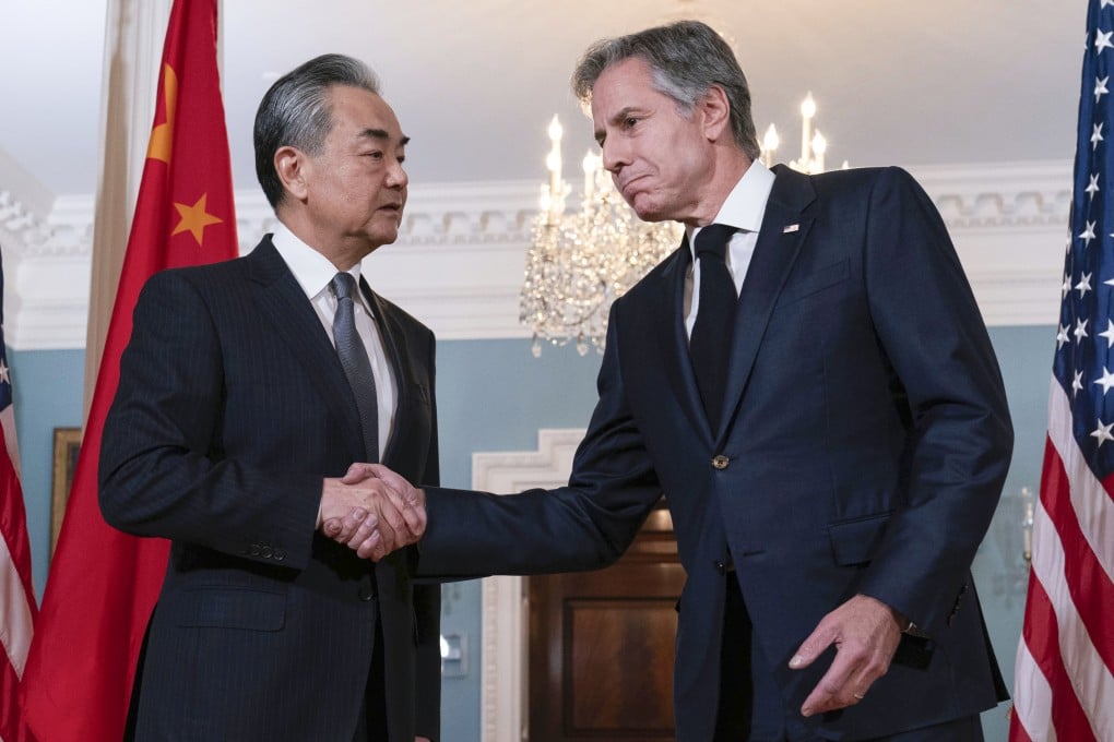 Foreign Minister Wang Yi shakes hands with US Secretary of State Antony Blinken after a meeting at the State Department in Washington on October 26. Photo: AP
