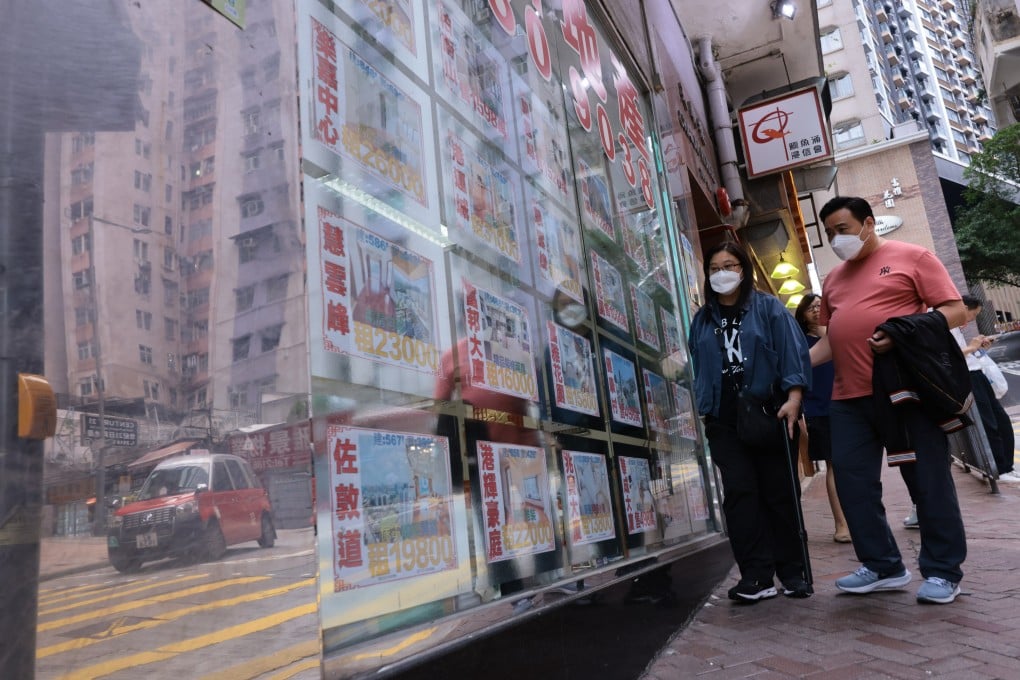 People check out residential property advertisements in the window of a real estate agency in North Point, Hong Kong, on October 29, 2023. Photo: May Tse