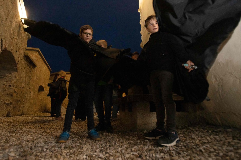 Children in Dracula costumes attend a tour at Forchtenstein Castle in Burgenland, Austria. Curators there are keen to separate the 15th century historical figure prince Vlad III Dracula, whose descendants owned the castle, from the fictional vampire Count Dracula based on him. Photo: AFP