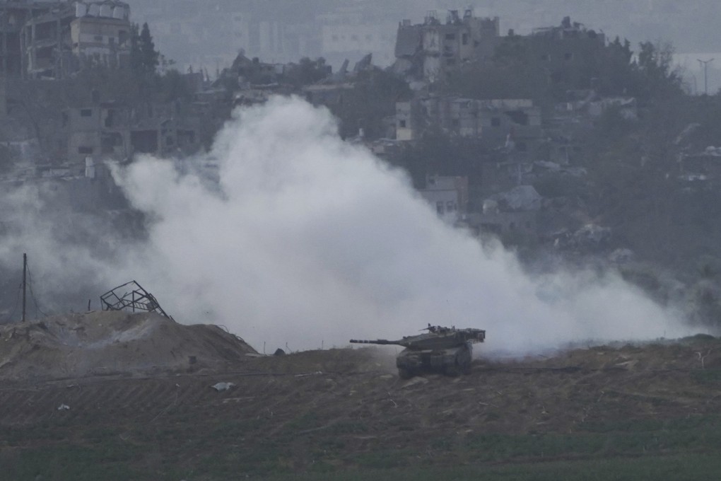 An Israeli tank along the Israeli border with the Gaza Strip, as seen from southern Israel on Sunday. Photo: AP