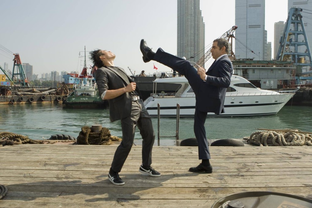 Rowan Atkinson as Johnny English  and Williams Belle as Ling in a still from  2011 film “Johnny English Reborn”, a spoof James Bond spy movie whose writers pulled out the stops to attract Chinese audiences.
