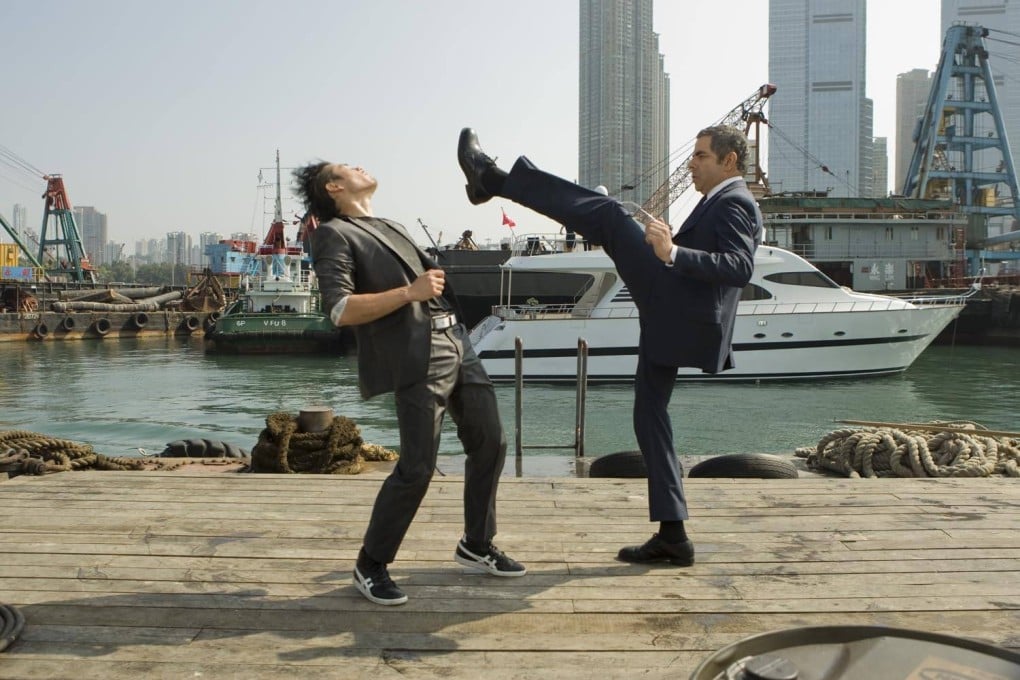 Rowan Atkinson as Johnny English and Williams Belle as Ling in a still from 2011 film “Johnny English Reborn”, a spoof James Bond spy movie whose writers pulled out the stops to attract Chinese audiences.