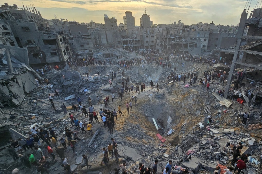 Palestinians search for casualties at the site of Israeli strikes on homes in the Jabalia refugee camp in the northern Gaza Strip on Tuesday. Photo: Reuters
