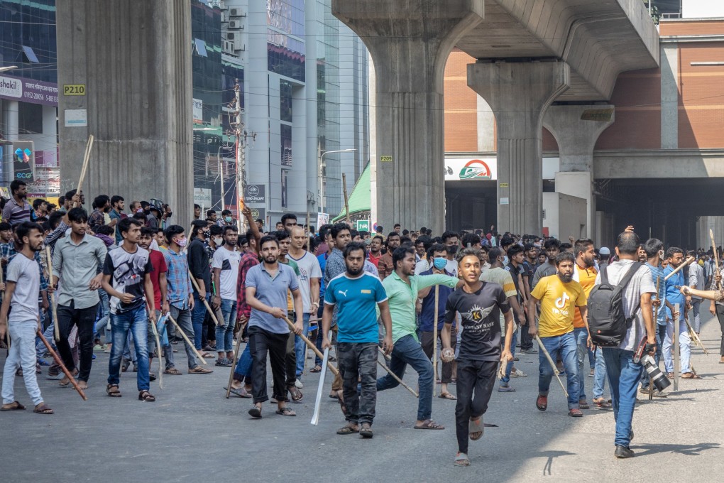 Bangladeshi garment workers block a road during a protest at the Mirpur area in Dhaka, Bangladesh, on Tuesday. Photo: EPA-EFE