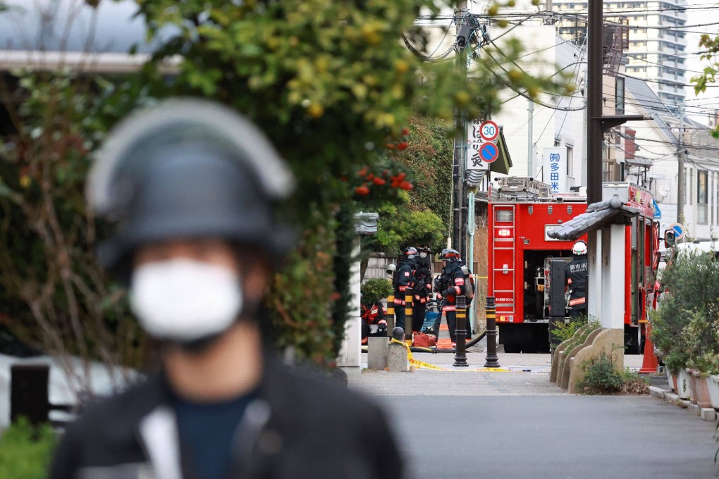 Police guard the area around a post office where a suspected gunman took people hostage in Warabi city in Saitama prefecture, near Tokyo, on Tuesday. Photo: AFP