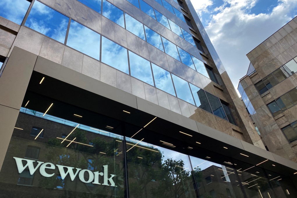 The logo of WeWork is seen in the window of an office building in London on July 3, 2020. Photo: Reuters