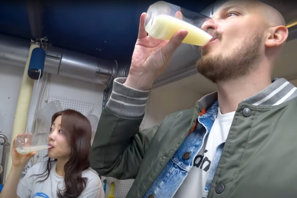 YouTuber Bart van Genugten and Seongsu-dong resident Hyona sample Hangang makgeolli rice wine in Seongsu-dong. Van Genugten is on a mission to document all of Seoul’s neighbourhoods in a YouTube travel guide. Photo: YouTube / @iGoBart