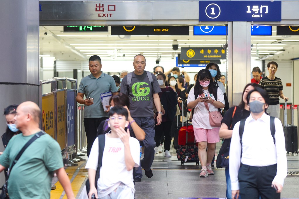 Travellers arrive in Shenzhen from Hong Kong after passing through the Lo Wu checkpoint. Photo: Edmond So