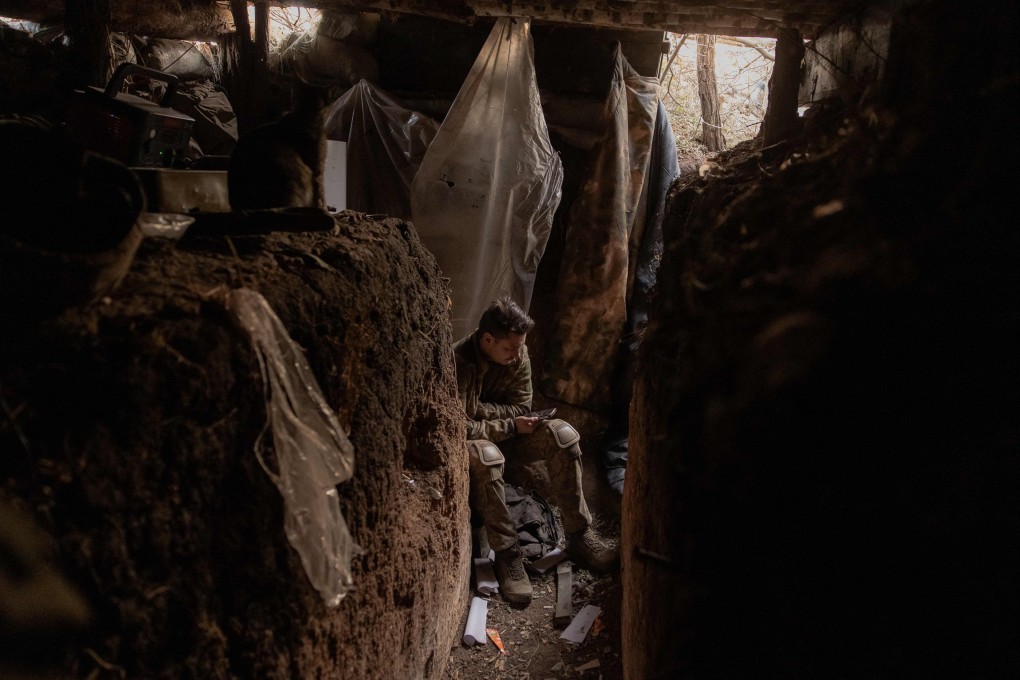 A Ukrainian soldier in a trench built by Russian forces, but captured by the Ukrainian army, in the Zaporizhzhia region. Photo: AFP