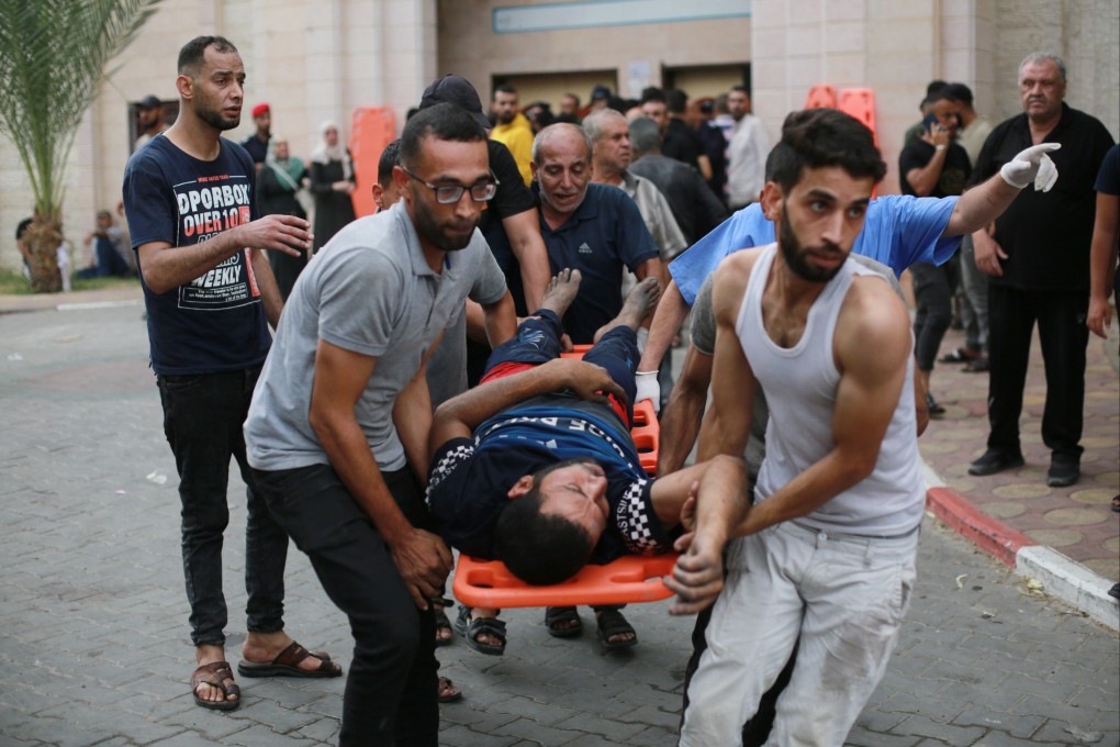 Palestinians and medical teams transport an injured man to the Indonesian Hospital following an Israeli air strike in Jabalia, north of the Gaza Strip, in October. Photo: dpa