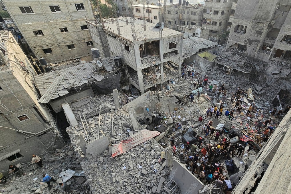 Palestinians search for casualties at the site of Israeli strikes on houses in the Jabalia refugee camp in the northern Gaza Strip on Thursday. Photo: Reuters