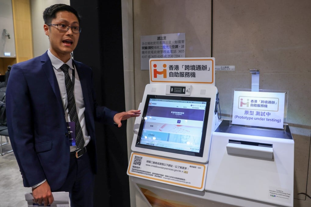 An official shows off one of the kiosks offering the new cross-border services. Photo: Yik Yeung-man