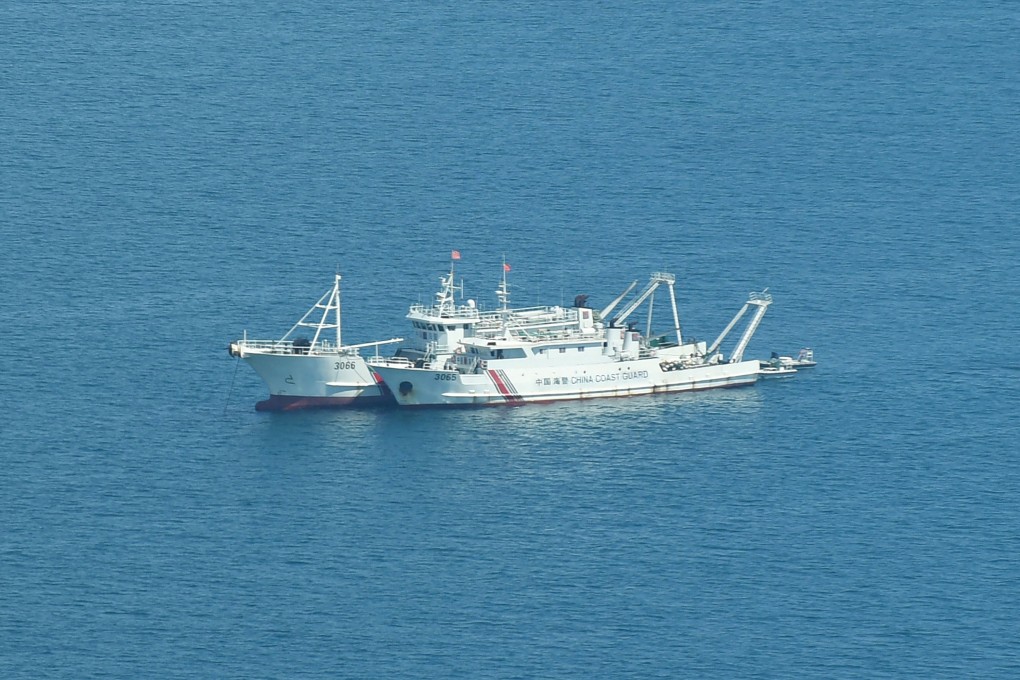 Chinese coastguard ships anchored inside the lagoon of the Beijing-controlled Scarborough Shoal in the South China Sea. Photo: AFP/Getty Images/TNS