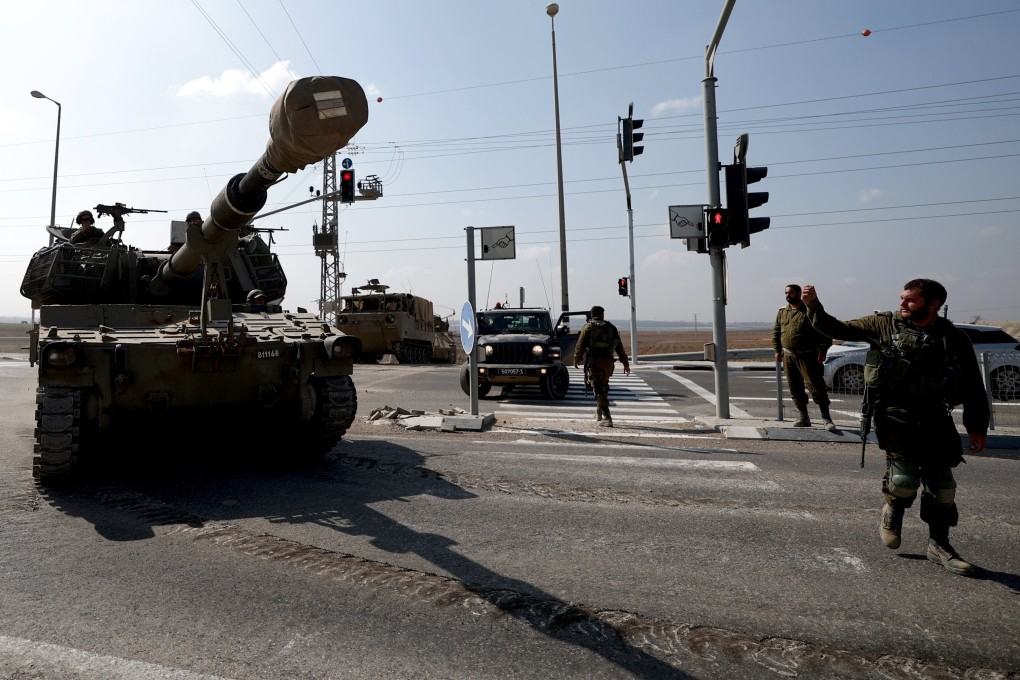 Israeli soldiers keep watch as a military vehicle moves toward the border with the Gaza Strip, southern Israel on Wednesday. Photo: EPA-EFE
