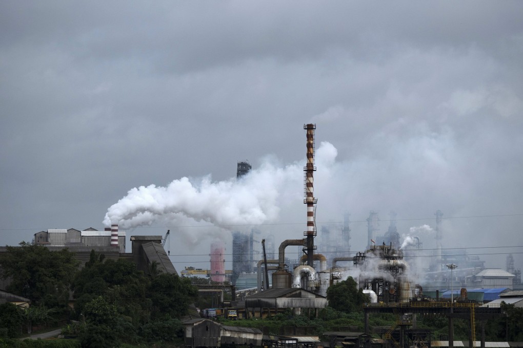 Steam emits from a crude oil refinery in Kochi, Kerala state, in August 2022. India is introducing measures to push its industries towards decarbonisation. Photo: AP