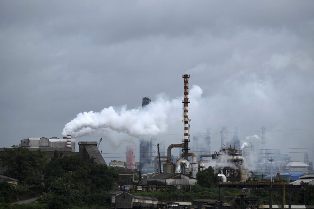 Steam emits from a crude oil refinery in Kochi, Kerala state, in August 2022. India is introducing measures to push its industries towards decarbonisation. Photo: AP