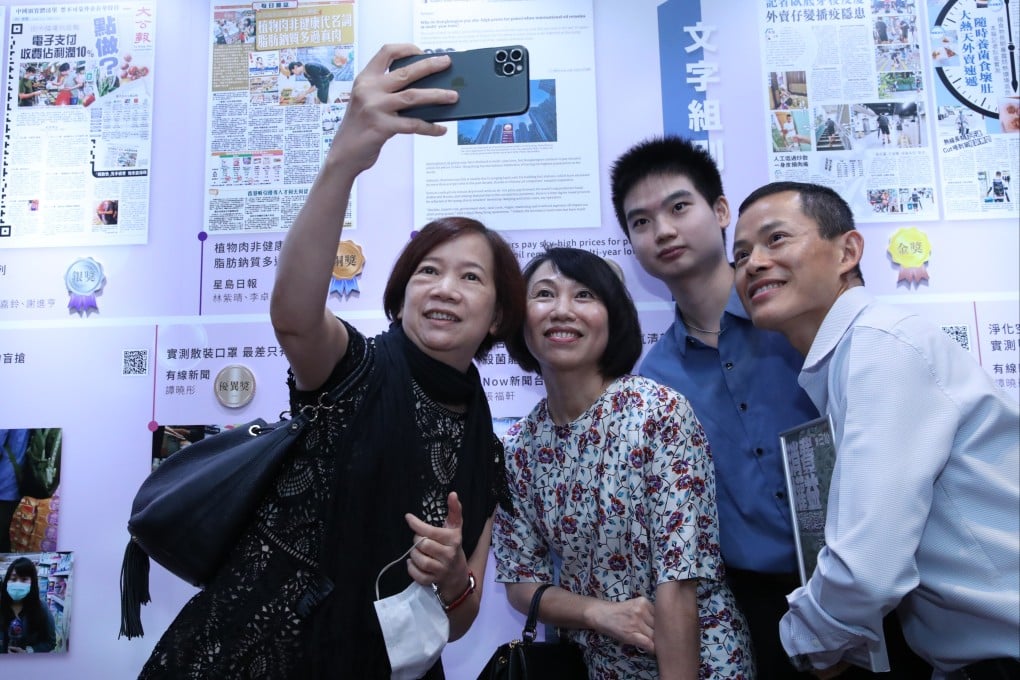Journalists of the Post celebrating at the 21st Consumer Rights Reporting Award on 31 August 2021. (L to R) Deputy Business Editor Peggy Sito, former Property Editor Sandy Li, former Senior Correspondent Lam Ka Sing, and Climate News Editor Eric Ng. Photo: Edmond So