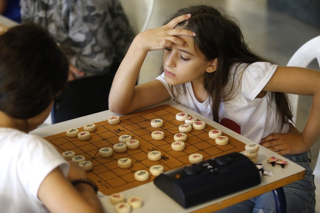 Participants compete in the first Confucius Institute Chinese chess championship in Beirut, Lebanon in October. Few such institutes remain in the US. Photo: Xinhhua