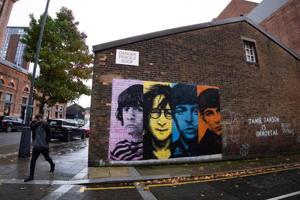 A person walks past a mural of the Beatles in Liverpool on Thursday. Photo: EPA-EFE