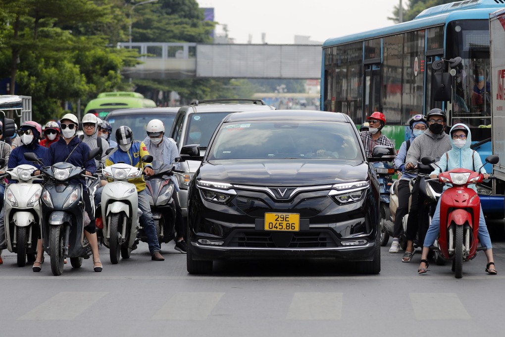 A Vinfast electric car is seen on a Hanoi street in August. Analysts say Vietnam is an outlier in Southeast Asia’s EV race, with less of a focus on attracting foreign direct investment and more on building up domestic brands. Photo: EPA-EFE