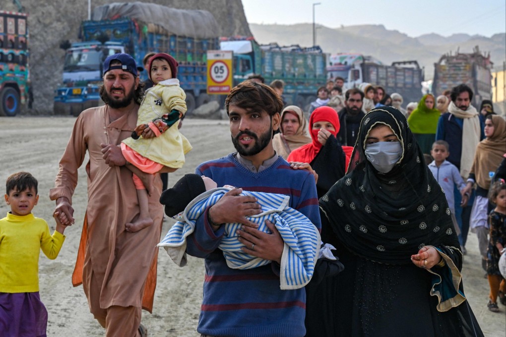 Afghan refugees in Pakistan walk towards the Pakistan-Afghanistan Torkham border on Friday. Photo: AFP