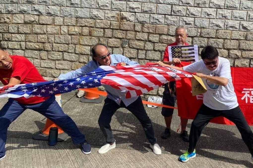 Protesters rip up an American flag outside the US consulate in Hong Kong, days after lawmakers proposed sanctions against city officials. Photo: Handout