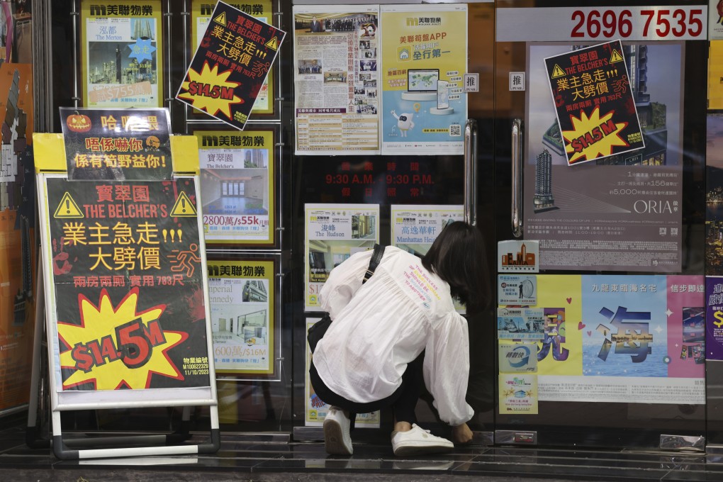 An agent opens a real estate office in Kennedy Town, Hong Kong, on November 2, 2023. Photo: Yik Yeung-man
