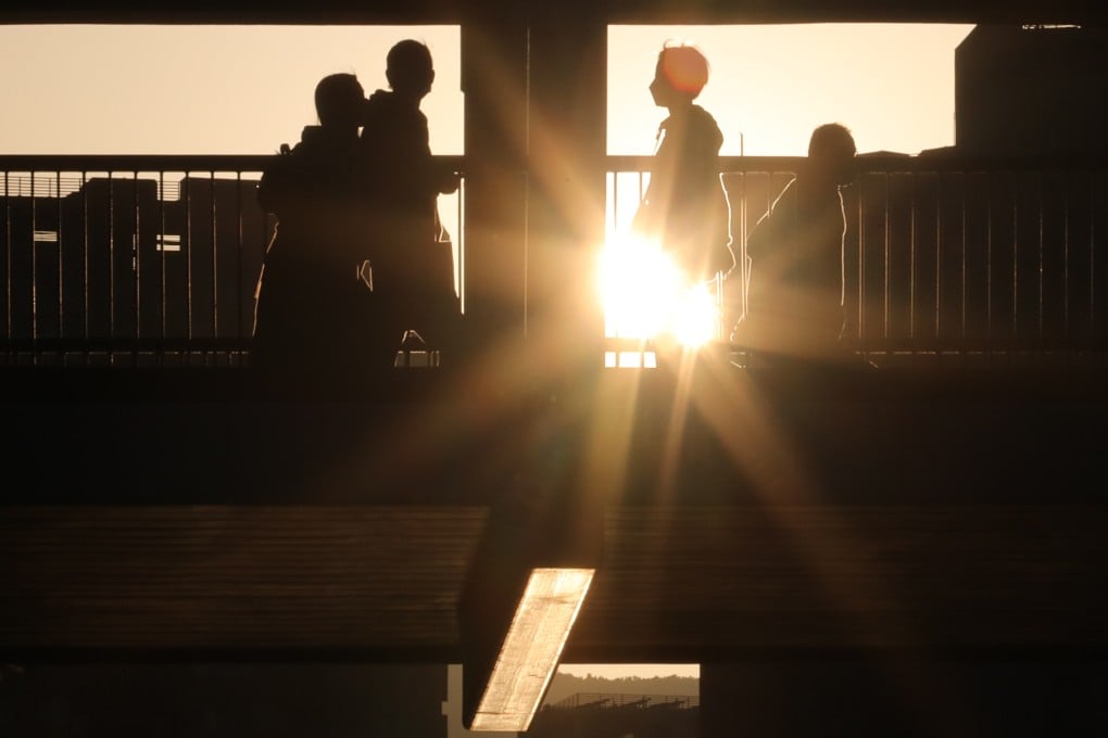 People walk on a bridge in Hong Kong’s Tai Po district in April last year. Studies have shown that high-income countries with relatively more resources in mental health care do not necessarily do better than their low- and middle-income counterparts. Photo: Jelly Tse