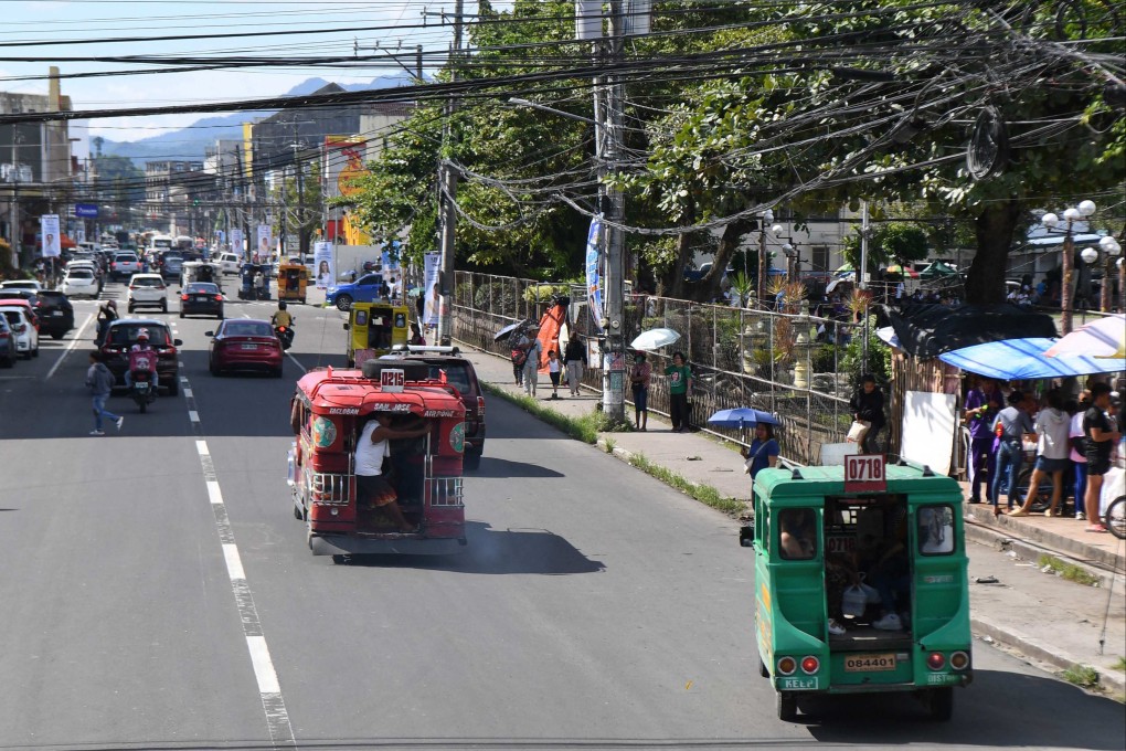 Vehicles and pedestrians along Justice Romualdez street in Tacloban city, Leyte province, 10 years after Super Typhoon Haiyan flattened towns and cities across central Philippines in 2013. Photo: AFP