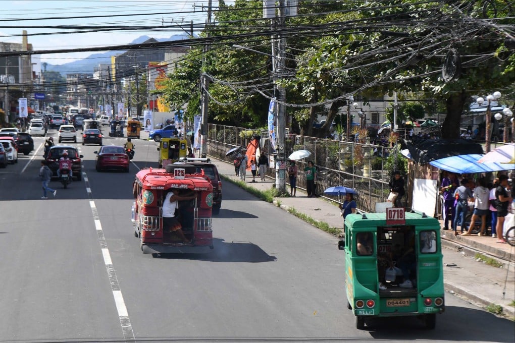 Vehicles and pedestrians along Justice Romualdez street in Tacloban city, Leyte province, 10 years after Super Typhoon Haiyan flattened towns and cities across central Philippines in 2013. Photo: AFP