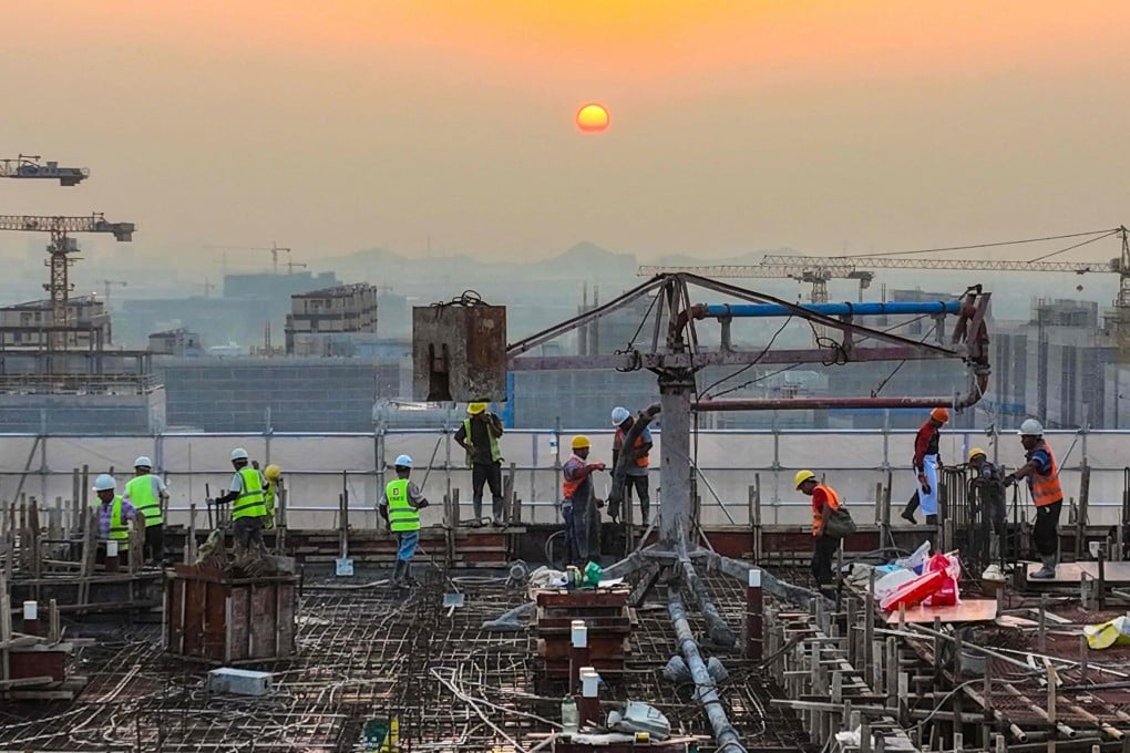 Workers are seen at a housing project construction site in Ningbo, in China’s Zhejiang province, on September 17. The persistent issues in China’s property sector call for for bold reforms from the central government in the face of global headwinds and resistance from interest groups. Photo: AFP