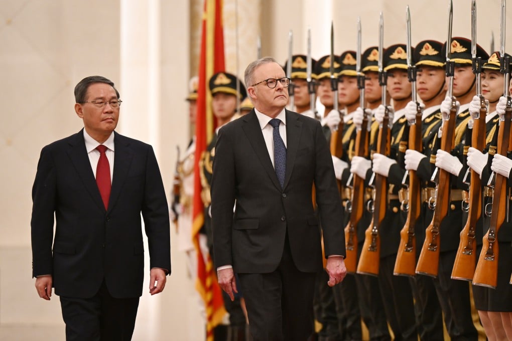 Australian Prime Minister Anthony Albanese (right) arrives to a ceremonial welcome with Chinese Premier Li Qiang at the Great Hall of the People in Beijing on Tuesday. Photo: dpa