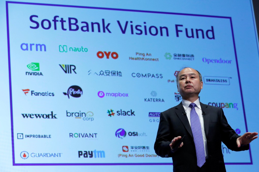 SoftBank Group Corp CEO Masayoshi Son attends a news conference in Tokyo in November 2018, in front of a screen showing the company's portfolio of start-ups. Photo: Reuters