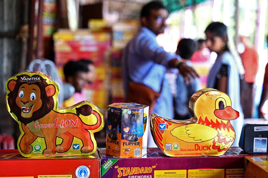 Customers buy firecrackers at a shop ahead of Diwali, the festival of lights, in Chennai on November 5. Given that India makes up 3 per cent of global economic output, compared to 18 per cent for China, talk of India becoming the world’s next growth engine is premature. Photo: AFP
