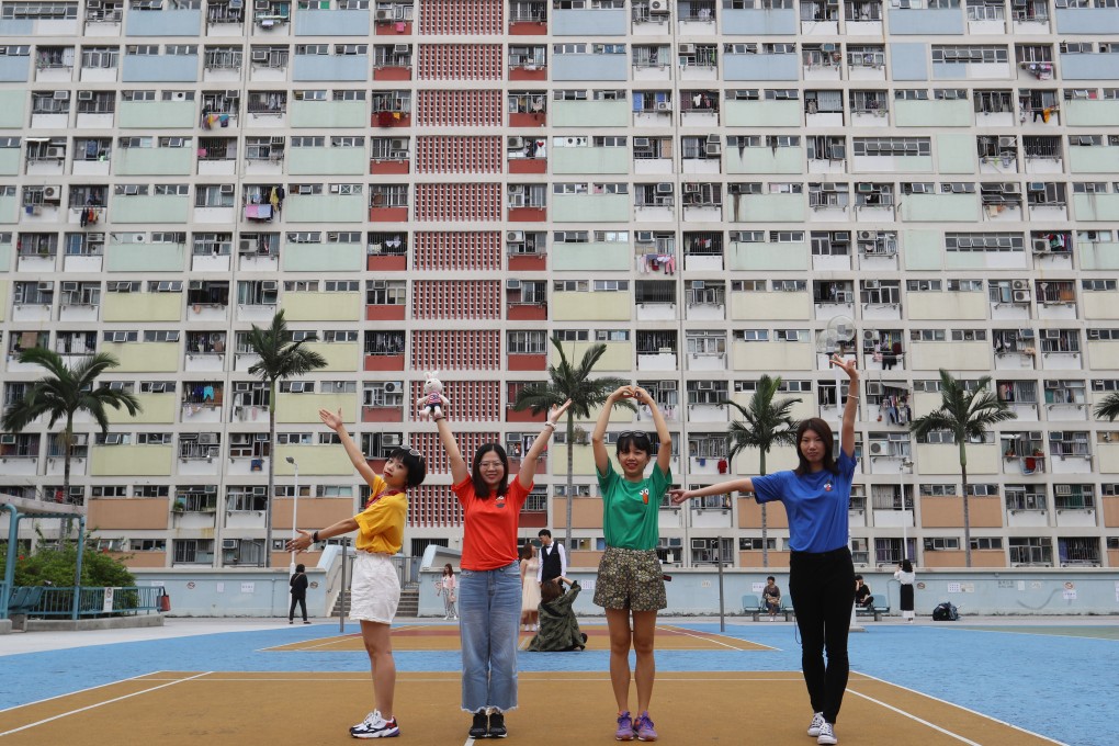 Tourists pose for photos at Choi Hung Estate, whose colourful facade has made it a selfie hotspot, on May 10, 2019. Hong Kong’s per capita living space is only 172 sq ft. Photo: Edmond So