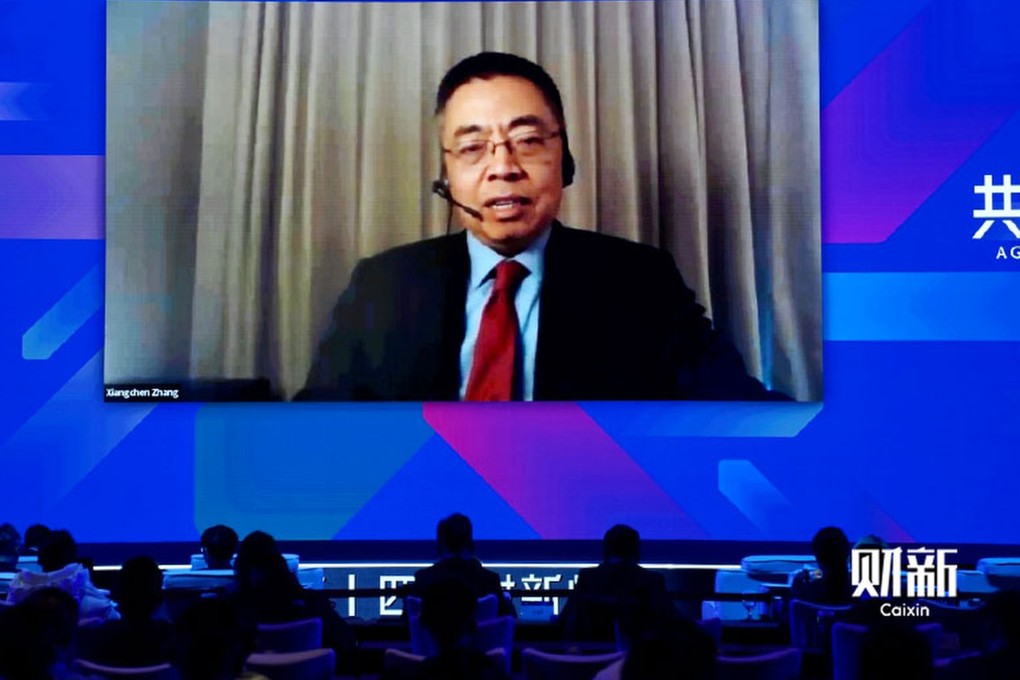 WTO deputy director general Zhang Xiangchen speaks on the opening day of the Caixin Summit in Beijing. Photo: Caixin