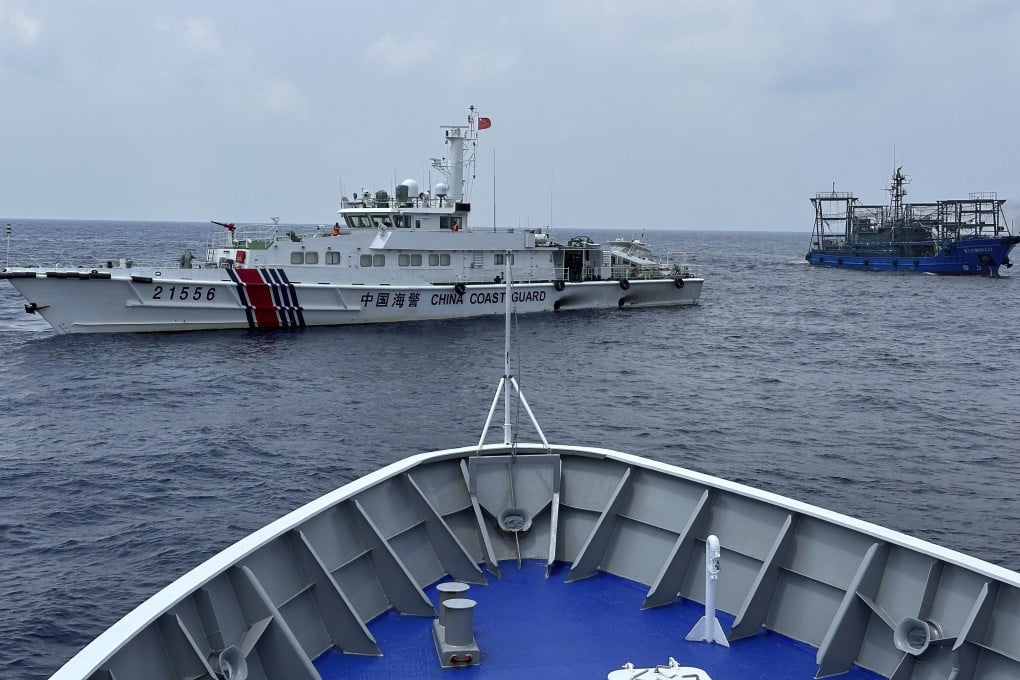 China and the Philippines have again accused each other of illegal behaviour over the Second Thomas Shoal. Weeks earlier, on October 4, a Chinese coastguard ship (left) is pictured with a Chinese militia vessel (right) blocking the Philippine coast guard ship BRP Sindangan. Photo: AP