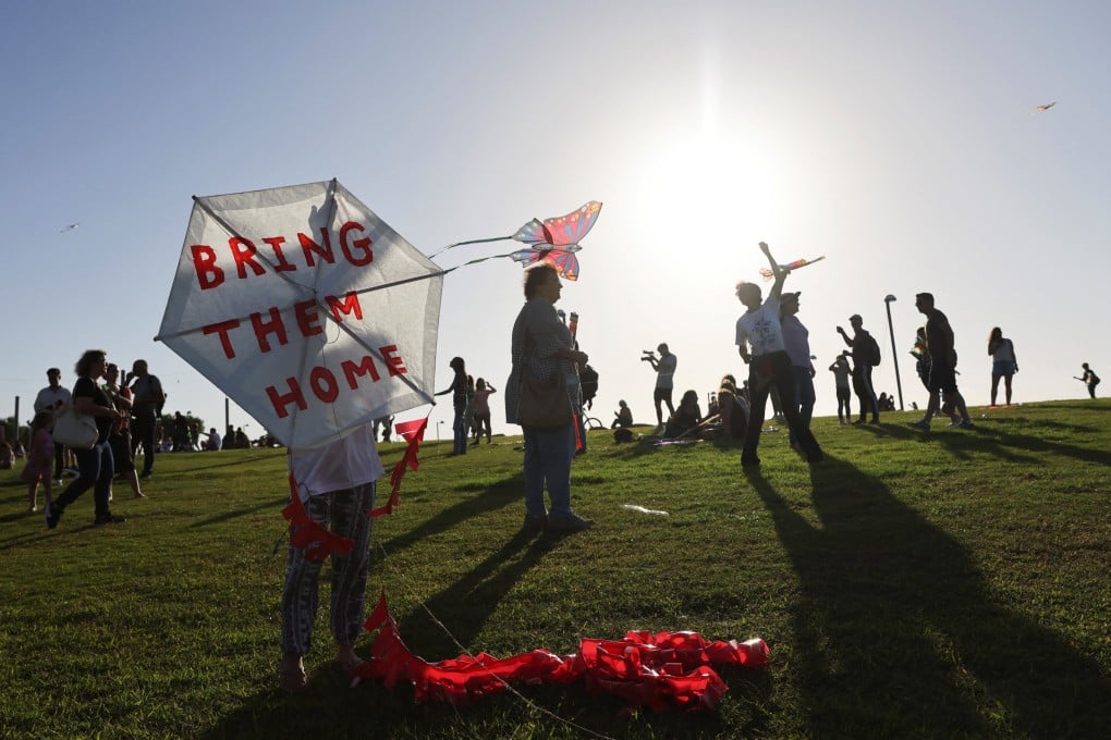 People take part in an event in Tel Aviv, Israel on Thursday, where they fly kites and demand the immediate release of hostages held in Gaza. Photo: Reuters
