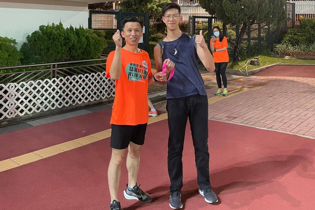 Liang Zhang (left) is a visually impaired runner taking on the TransLantau. Photo: Handout