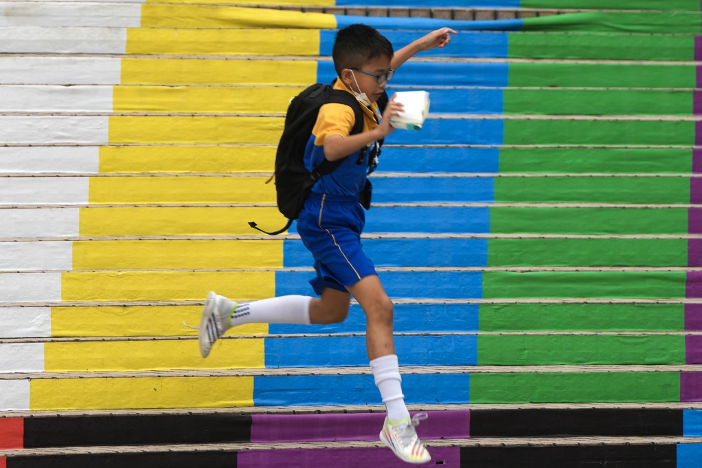 A student jumps on a colourful staircase at the Hong Kong Cultural Centre in Tsim Sha Tsui. The government’s pledge of support for improving students’ mental health is at odds with the grant of just HK$80,000 per school, an amount to be split between the schools and the parent-teacher associations. Photo: Sam Tsang