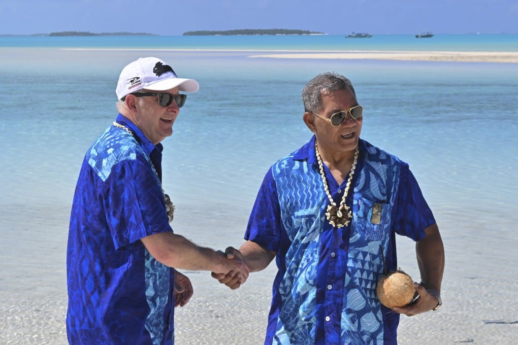 Australian Prime Minister Anthony Albanese (left) and Tuvalu leader Kausea Natano shake hands after attending the Pacific Islands Forum in Aitutaki, Cook Islands, on Thursday. Photo: AAP Image via AP