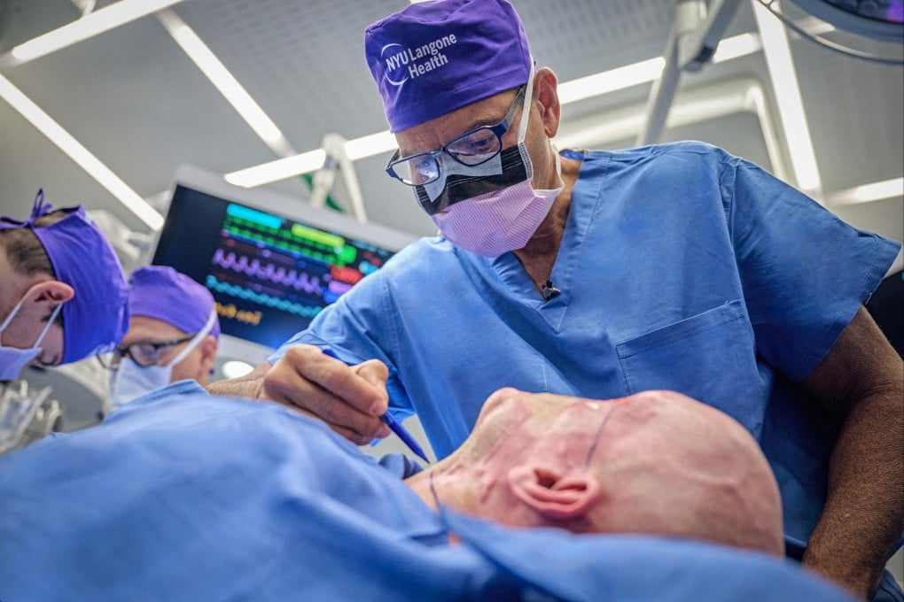 Dr Eduardo D. Rodriguez prepares Aaron James for the world’s first whole-eye transplant as part of a partial face transplant at NYU Langone in New York. Photo: NYU Langone Health via Reuters